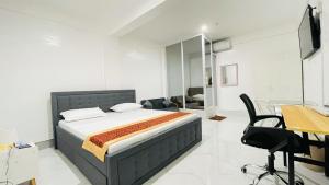 Postelja oz. postelje v sobi nastanitve Legends Hotel & Events Hall - Lemery & Taal