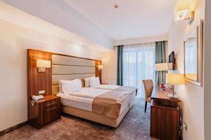 Postel nebo postele na pokoji v ubytování Radsor Hotel