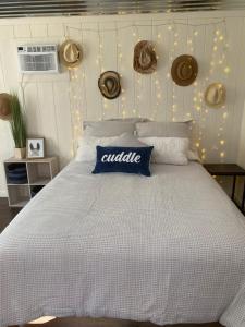 a bedroom with a large bed with a white comforter at McMillan Ranch Yosemite in Coarsegold