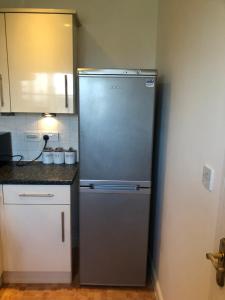 a stainless steel refrigerator in a kitchen at Summerville in Kent