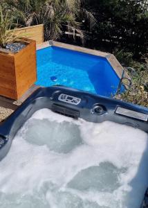 a jacuzzi tub with snow in it at Studio port pin vue mer, jacuzzi, hammam, parking PRIVES in Cassis