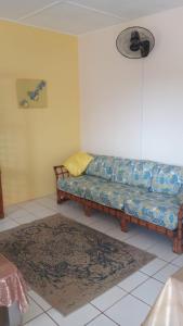 a living room with a couch and a rug at Sunflower Nest in Runaway Bay