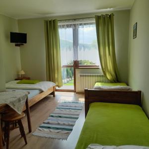 Llit o llits en una habitació de Willa Bańkoszówka