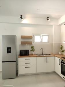 Η κουζίνα ή μικρή κουζίνα στο Villa Areti