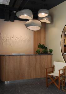 a waiting room with a counter and a mirror at Four Sides Beyoglu in Istanbul