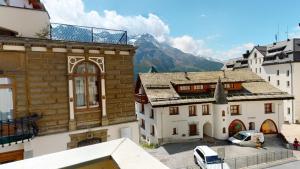 an aerial view of a city with buildings and mountains at Paravicini 1 in St. Moritz