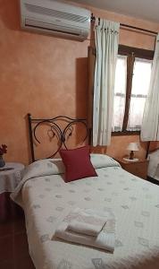 Łóżko lub łóżka w pokoju w obiekcie Casa Rural Aguascebas