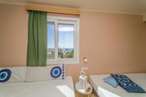 Postel nebo postele na pokoji v ubytování Amaryllis front beach hotel