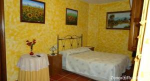 Łóżko lub łóżka w pokoju w obiekcie Casa Rural Aguascebas