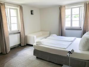 Кровать или кровати в номере Landhaus am Jungfernsee