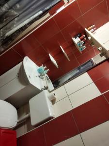 an overhead view of a bathroom with a toilet and a sink at Lara in Doboj