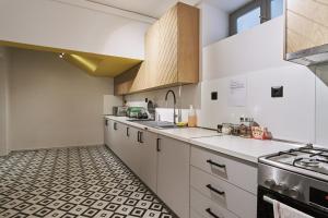 A kitchen or kitchenette at When in Athens Hostel