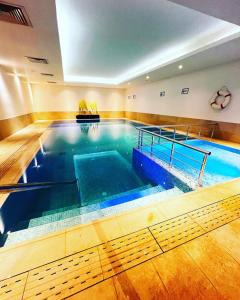 a large indoor swimming pool in a building at Seminal Hotel Taksim in Istanbul