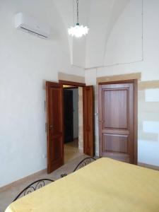 A bed or beds in a room at Regina Elena Casa Vacanze Salento