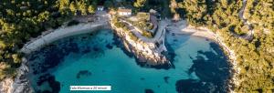 an aerial view of a pool of blue water at APPARTAMENTO CORALLO with PRIVATE GARDEN in Olbia