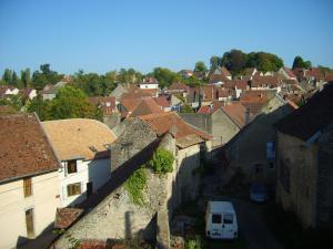 a view of a town with houses and a street at Appartement près de DOLE in Menotey
