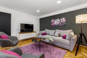 Televízia a/alebo spoločenská miestnosť v ubytovaní Apartment Sancti Viti