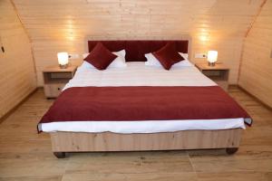En eller flere senge i et værelse på La Casute