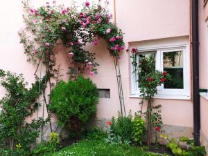a house with flowers on the side of it at Apartman Medrese in Sarajevo