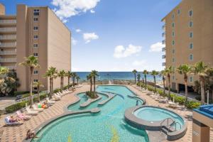 an image of a swimming pool at the resort at Crystal Tower 1906 by Vacation Homes Collection in Gulf Shores