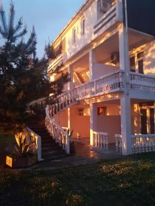 a large building with a staircase leading up to it at Seaside House Kobuleti in K'obulet'i