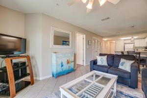 a living room with a couch and a tv at Ciboney Condominiums by Panhandle Getaways in Destin