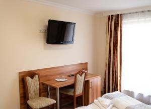 TV a/nebo společenská místnost v ubytování Hotel Kennedy + 34 fotografií