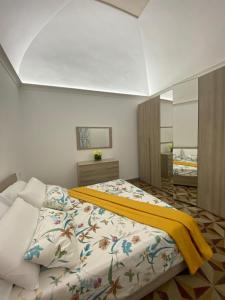 A bed or beds in a room at M.Mansion