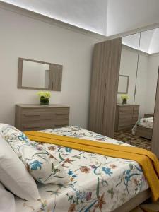A bed or beds in a room at M.Mansion