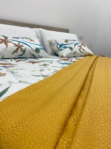 A bed or beds in a room at M.Mansion