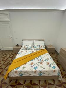 A bed or beds in a room at M.Mansion
