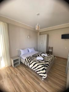 Voodi või voodid majutusasutuse Tornado Hotel toas