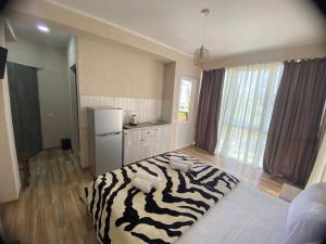 Voodi või voodid majutusasutuse Tornado Hotel toas