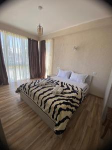 Voodi või voodid majutusasutuse Tornado Hotel toas