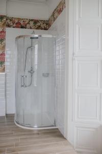 a shower in a bathroom with a glass shower at Noan Country House B&B in Cashel