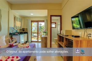 TV a/nebo společenská místnost v ubytování i9 Quixaba Flat