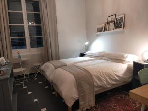 A bed or beds in a room at Dimora Caffaro
