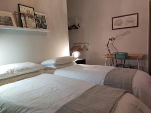 A bed or beds in a room at Dimora Caffaro