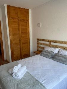 Łóżko lub łóżka w pokoju w obiekcie El Nuevo Faro