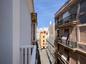 a view of an alley between two buildings at El Rincón de Fabio Little Apartments in Cádiz