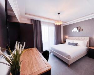 Postel nebo postele na pokoji v ubytování Sliema Studios + 13 fotografií