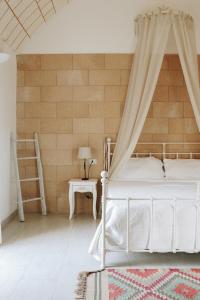 מיטה או מיטות בחדר ב-Masseria Petrusella