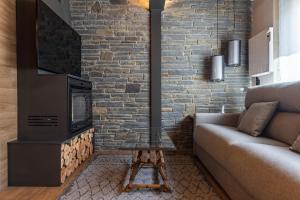 Televízia a/alebo spoločenská miestnosť v ubytovaní Cerdanya Mountain Residences