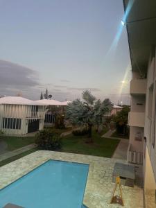 Pemandangan kolam renang di Boquerón Beach Apartment.- Guarionex 207 atau berdekatan