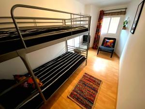 Posteľ alebo postele v izbe v ubytovaní Cornu Karma Apartment El Pati + 7 fotografií
