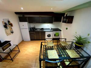 Kuchyňa alebo kuchynka v ubytovaní Cornu Karma Apartment El Pati