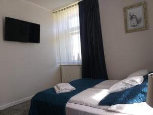 Posteľ alebo postele v izbe v ubytovaní Apartamenty i pokoje gościnne KOŁODZIEJÓWKA