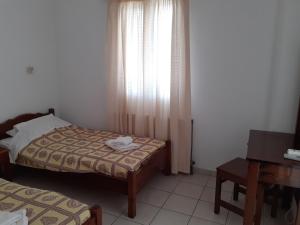 Postel nebo postele na pokoji v ubytování Γαληνη