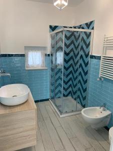Ванна кімната в LA CASA DI PIETRA