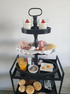 a tray of breakfast food on a table at Ruunerwoldse Stekkie met eigen badkamer in Ruinerwold